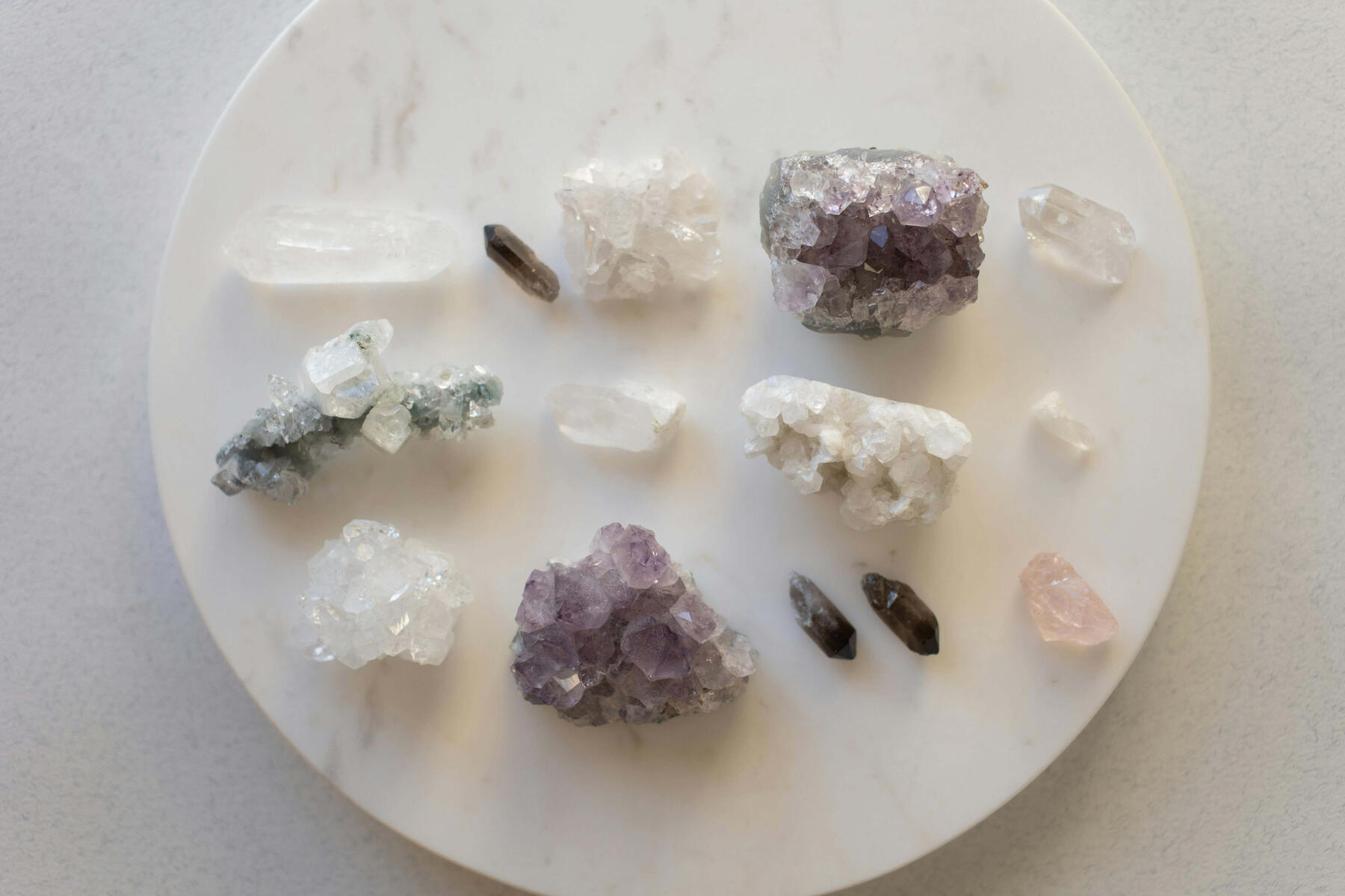 Crystal grid manifestation Photo of Clear Quartz, Smoky Quartz and Amethyst crystals.